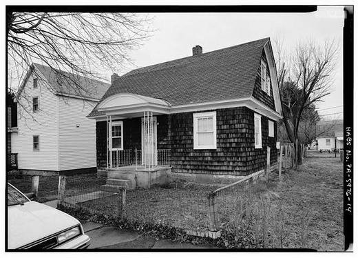 Close view of vermont farmhouse-style home with original porch roof and siding, no. 43 poplar street. - town of Kistler, Kistler, mifflin county, PA