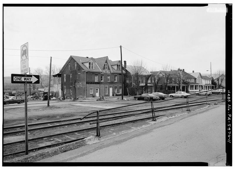 The Kenmar Hotel on Pennsylvania Avenue, photographed for the federal survey in 1991. The railroad track in the foreground is the old main line right of way, by then a transfer siding.