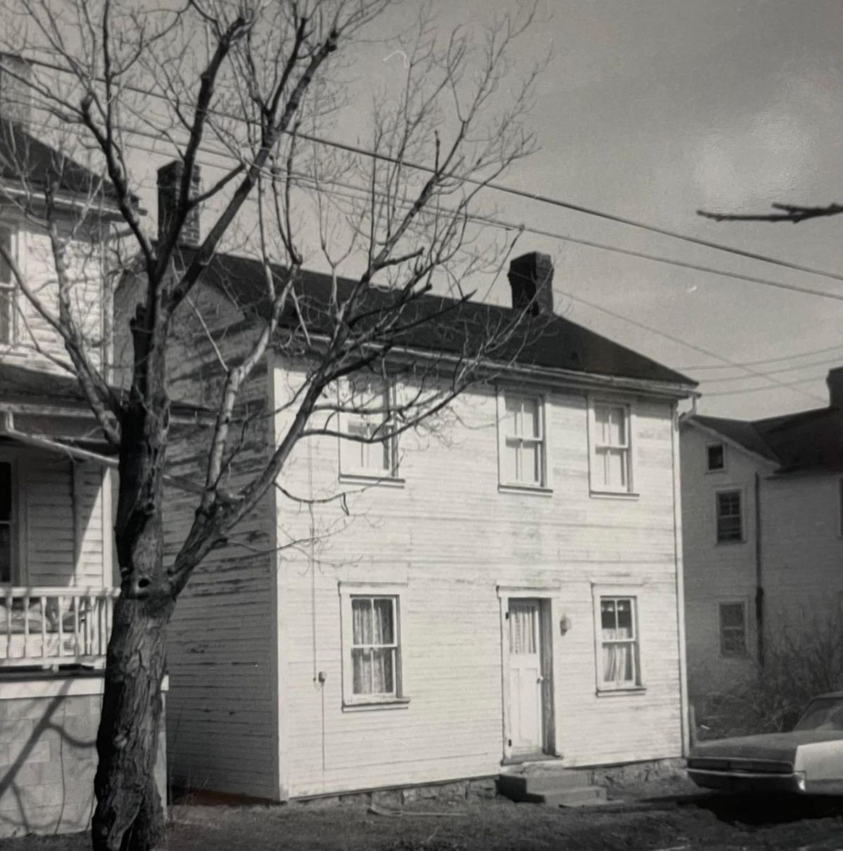 A two-story clapboard house that Myer Souders identifies as his mother's little house in the lower section of Aitch.