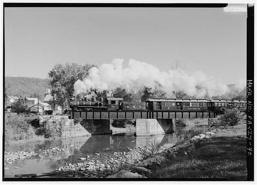 40. View of Locomotive No. 12 about a quarter mile north of Orbisonia, crossing steel I-beam plate girder bridge after clearing yard at Orbisonia - East Broad Top Railroad