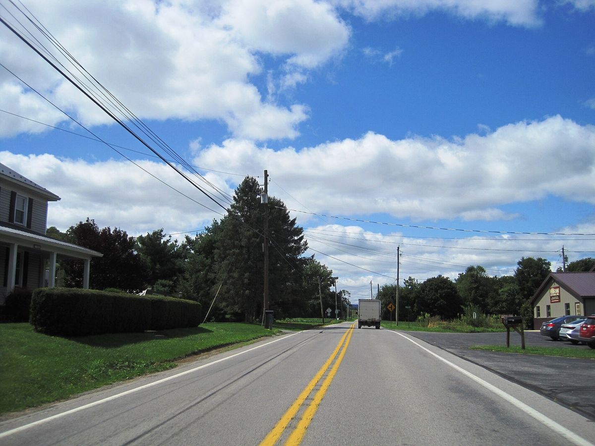 westbound Pennsylvania Route 305 (Shavers Creek Road) in the village of Ribot within Logan Township, Huntingdon County, Pennsylvania. Photo taken looking south-southwest between McMahon Road and Mill Road.